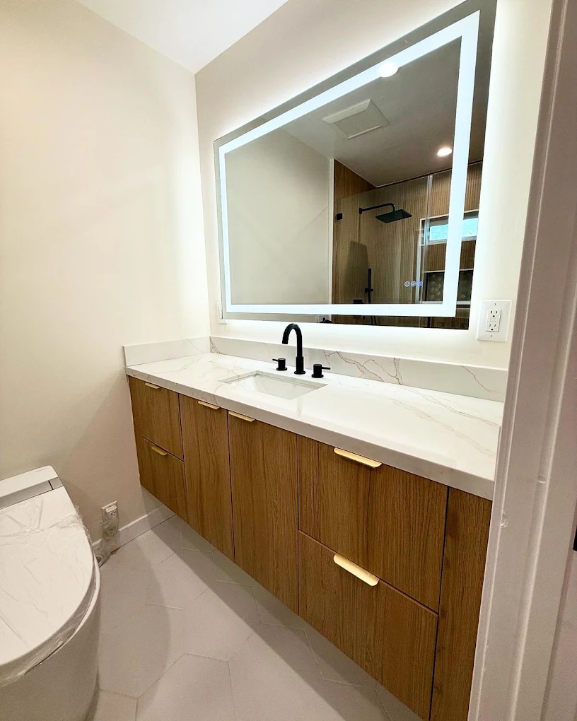 Floating oak vanity with backlit LED mirror