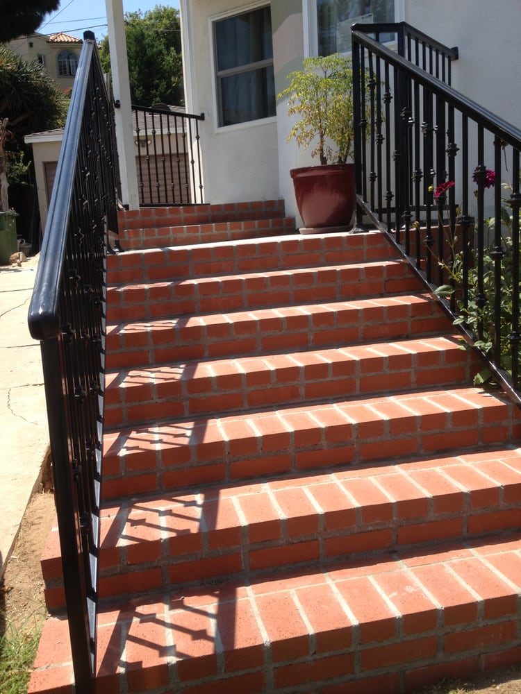 Brick entry steps & iron railing